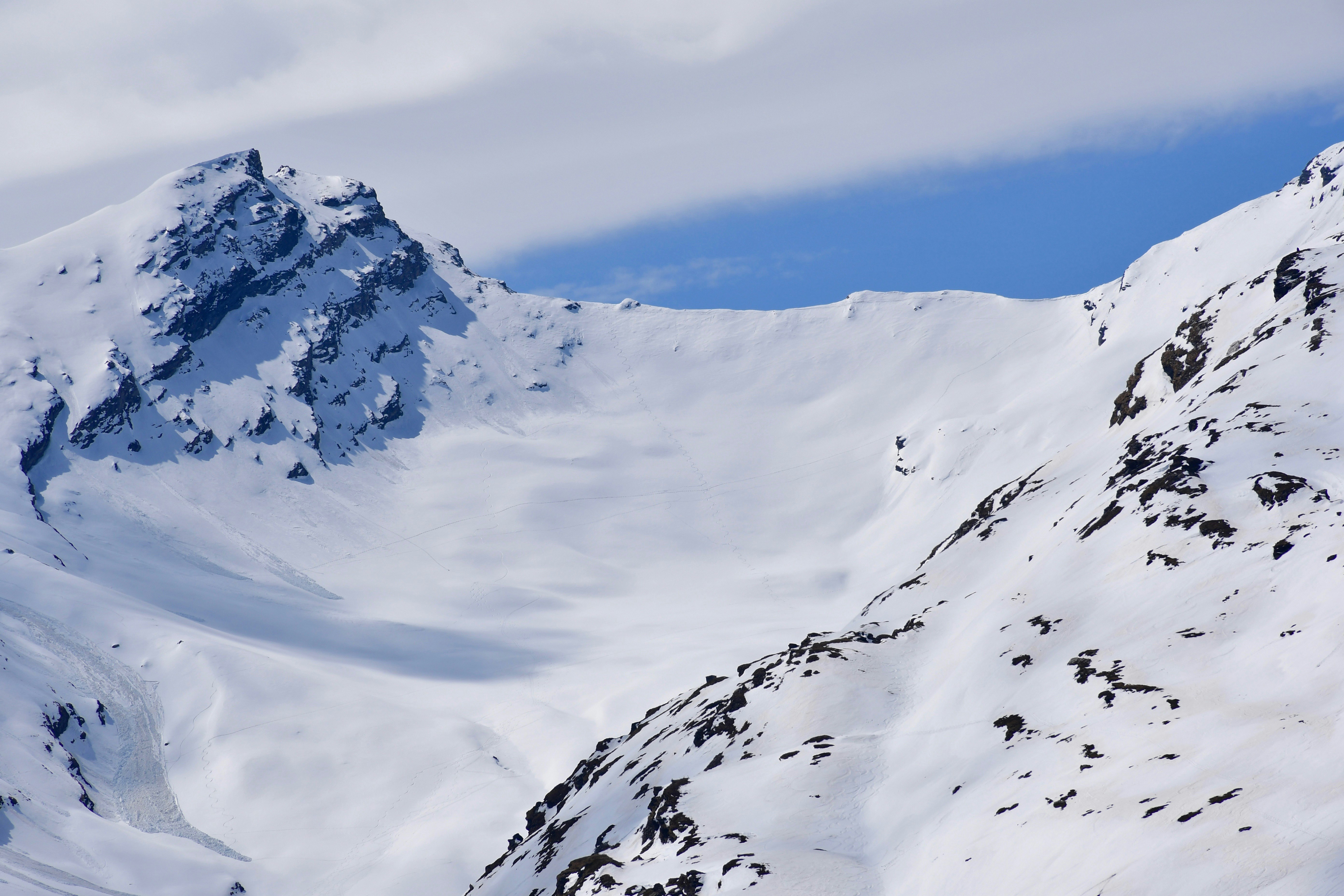 snow covered mountain under blue sky during daytime